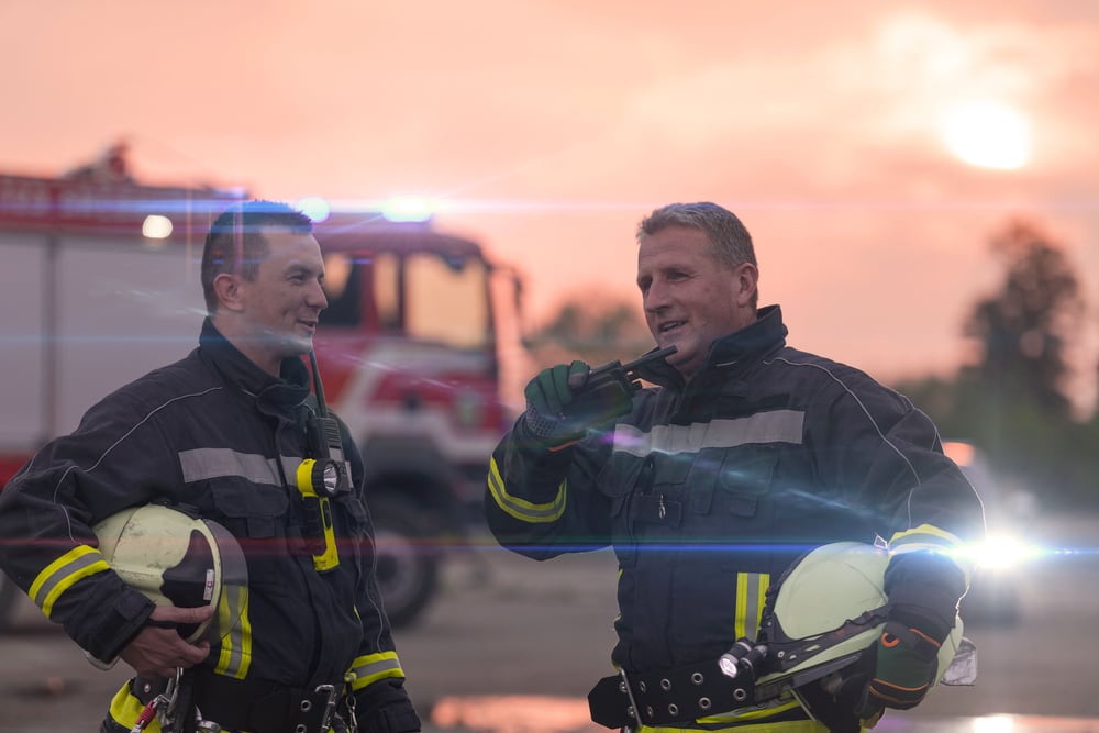 Firefighting crew with their appliance at dusk