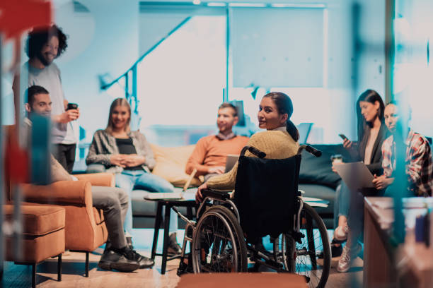 Businesswoman in a wheelchair in a team meeting